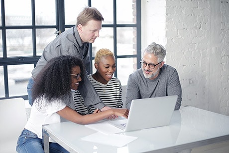 Developers collaborating around DevOps and Kubernetes workflows